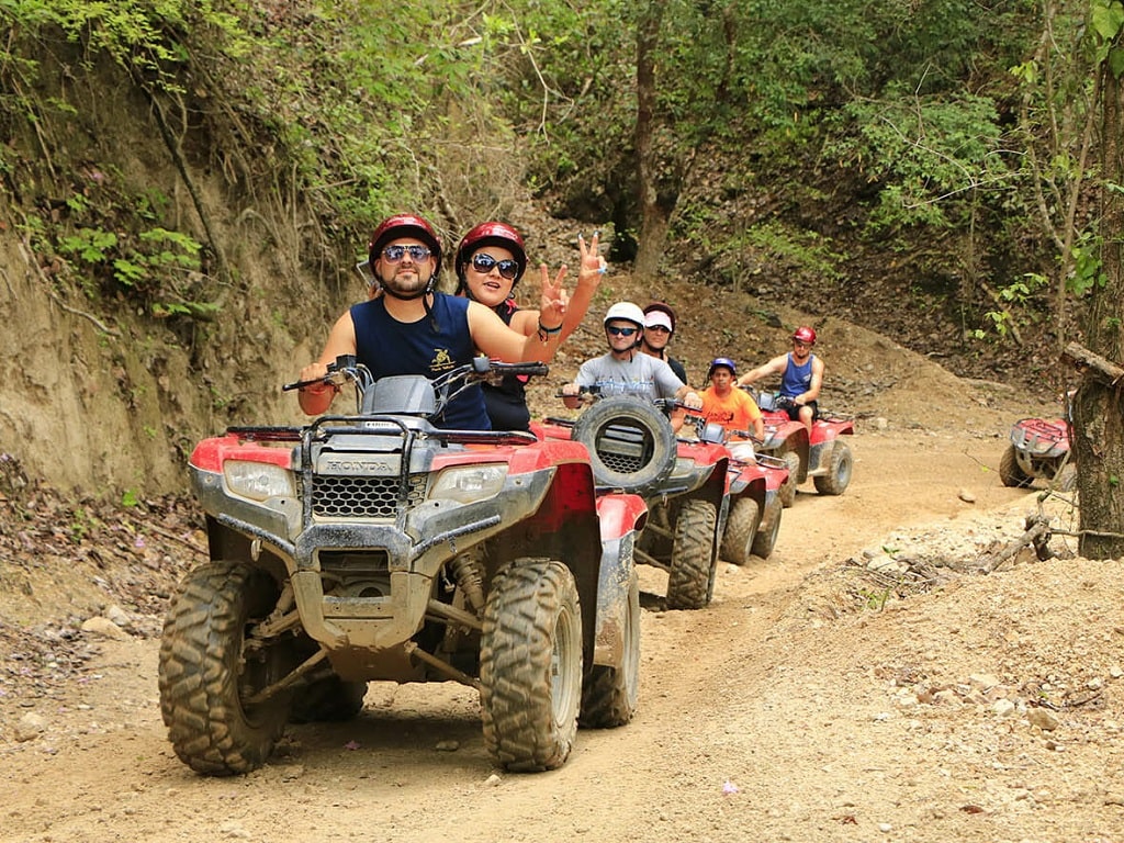 Alanya quad safari group riding through dusty mountain route