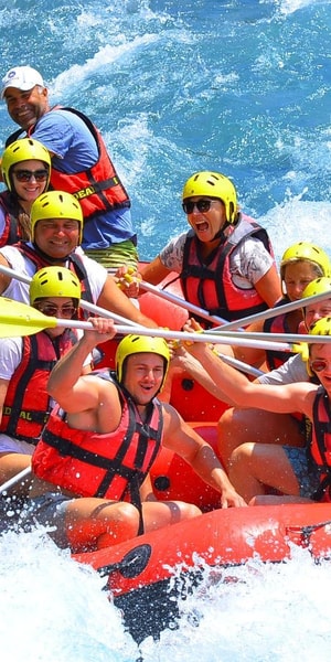 Action-packed Alanya rafting boat in white water rapids with excited guests