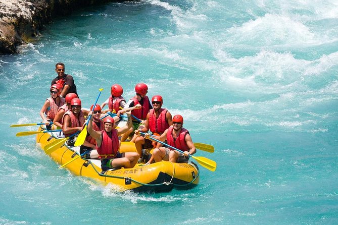 Bright yellow raft floating through vivid blue Köprülü Canyon water