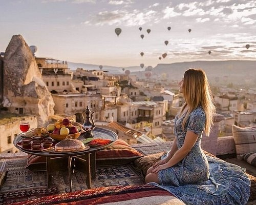 Terrace breakfast with Cappadocia balloons view