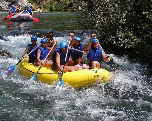 Best Alanya rafting tour image with paddlers navigating a rapid in clear river water