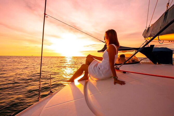 Woman enjoying sunset on yacht